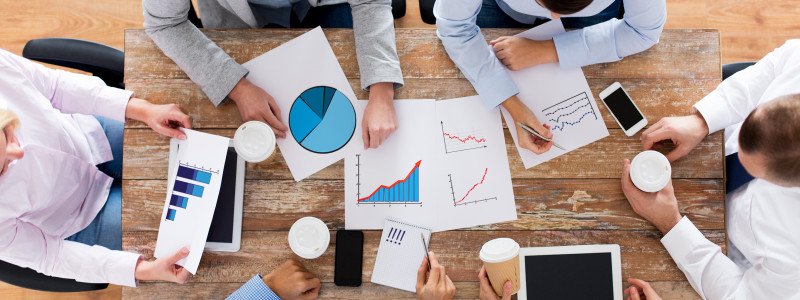 business, people, statistics and team work concept - close up of